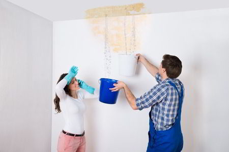 couple with water damage in ceiling